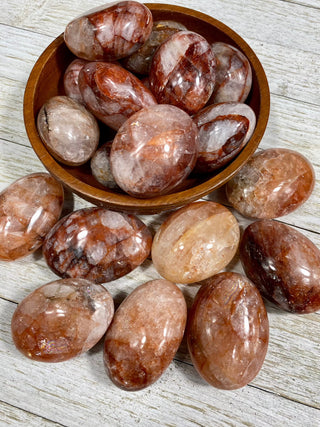 Hematite in Quartz Palm Stone from Curious Muse Crystals Tagged with carving, clear, crystal, hematite, hematite red quartz, hematoid quartz, orange, palm stone, palmstone, polished, quartz