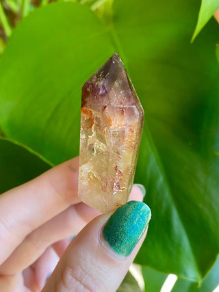 Dreamcoat Lemurian Generator - Polished Brazilian Tower Crystal from Curious Muse Crystals Tagged with clear, clear brazil quartz, dreamcoat lemurian, goethite rutile, hematite amethyst, hide-notify-btn, lemurian, lemurian generator, lemurian seed, polished, purple, red, secondary growth, super seven, synergy seven, tower, yellow