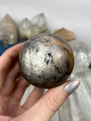 Black Moonstone Sphere | Flashy Orthoclase from Curious Muse Crystals Tagged with black, black moonstone, Crystal healing, genuine crystal, hide-notify-btn, moonstone, orthoclase, silver, sphere