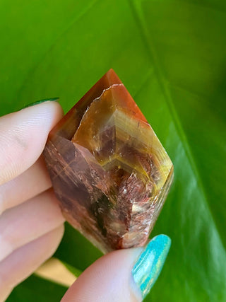 Dreamcoat Lemurian Generator - Polished Brazilian Tower Crystal from Curious Muse Crystals Tagged with clear, clear brazil quartz, dreamcoat lemurian, goethite rutile, hematite amethyst, hide-notify-btn, lemurian, lemurian generator, lemurian seed, polished, purple, red, secondary growth, super seven, synergy seven, tower, yellow