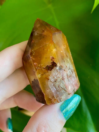 Dreamcoat Lemurian Generator - Semi-Polished Brazilian Tower Crystal from Curious Muse Crystals Tagged with clear, clear brazil quartz, dreamcoat lemurian, goethite rutile, hematite amethyst, hide-notify-btn, lemurian, lemurian generator, lemurian seed, purple, red, secondary growth, super seven, synergy seven, yellow