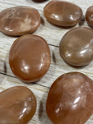 Sunstone with Moonstone Flashy Palm Stone from Curious Muse Crystals Tagged with Feldspar, moonstone, orange, orthoclase, orthoclase feldspar, palm stone, palmstone, sunstone