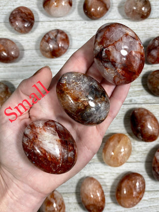 Hematite in Quartz Palm Stone from Curious Muse Crystals Tagged with carving, clear, crystal, hematite, hematite red quartz, hematoid quartz, orange, palm stone, palmstone, polished, quartz