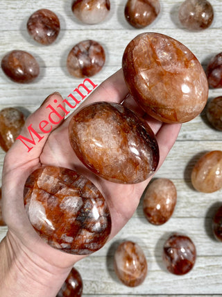 Hematite in Quartz Palm Stone from Curious Muse Crystals Tagged with carving, clear, crystal, hematite, hematite red quartz, hematoid quartz, orange, palm stone, palmstone, polished, quartz