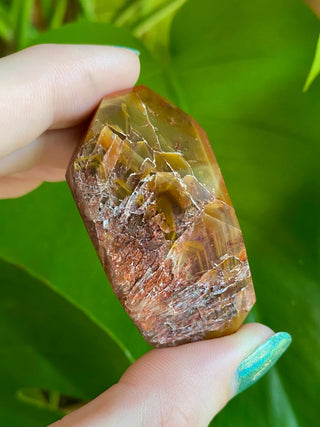 Dreamcoat Lemurian Generator - Polished Brazilian Tower Crystal from Curious Muse Crystals Tagged with clear, clear brazil quartz, dreamcoat lemurian, goethite rutile, hematite amethyst, hide-notify-btn, lemurian, lemurian generator, lemurian seed, polished, purple, red, secondary growth, super seven, synergy seven, tower, yellow