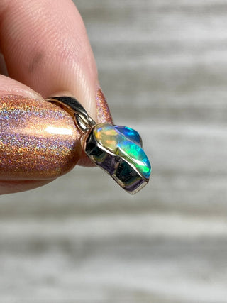 Welo Opal Raw Form in Sterling Silver Pendant from Curious Muse Crystals Tagged with crystal healing, Crystal Jewelry, energy work, Ethiopian opal, flashy opal, hide-notify-btn, october crystal, opal crystal pendant, rainbow, reiki crystal, Sterling, sterling silver, Welo Opal, white opal pendant, witchy jewelry