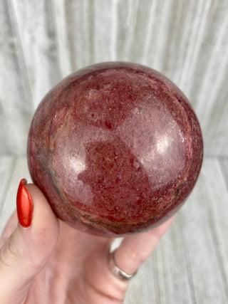 Rhodonite Sphere from Madagascar from Curious Muse Crystals Tagged with crystal, crystal energy, crystal sphere, hide-notify-btn, madagascar, palm stone, palmstone, pink, polished, red, reiki healing, Rhodonite, sphere