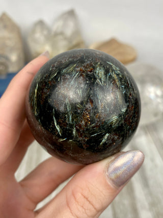 Astrophyllite with Garnet Sphere from Curious Muse Crystals Tagged with astrophyllite, black, blue, garnet, gold, hide-notify-btn, high quality, red, sphere
