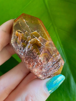 Dreamcoat Lemurian Generator - Polished Brazilian Tower Crystal from Curious Muse Crystals Tagged with clear, clear brazil quartz, dreamcoat lemurian, goethite rutile, hematite amethyst, hide-notify-btn, lemurian, lemurian generator, lemurian seed, polished, purple, red, secondary growth, super seven, synergy seven, tower, yellow