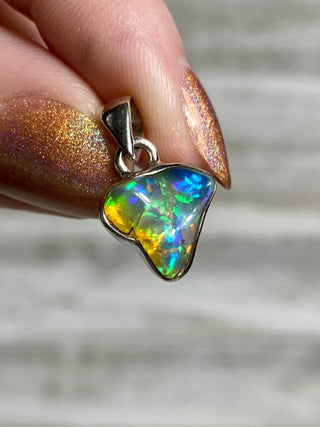 Welo Opal Raw Form in Sterling Silver Pendant from Curious Muse Crystals Tagged with crystal healing, Crystal Jewelry, energy work, Ethiopian opal, flashy opal, hide-notify-btn, october crystal, opal crystal pendant, rainbow, reiki crystal, Sterling, sterling silver, Welo Opal, white opal pendant, witchy jewelry