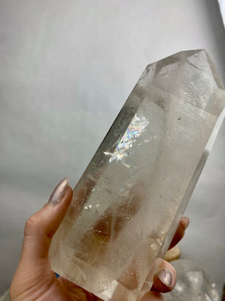 Lemurian Quartz Polished Tower | Rainbow Inclusions | Six Side Generator from Curious Muse Crystals Tagged with clear, clear brazil quartz, clear quartz, Crown crystal, hide-notify-btn, lemurian, lemurian generator, Lemurian Quartz, lemurian seed, quartz, rainbow, sunset mine, tower