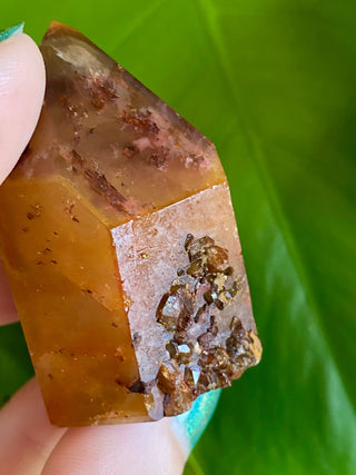 Dreamcoat Lemurian Generator - Semi-Polished Brazilian Tower Crystal from Curious Muse Crystals Tagged with clear, clear brazil quartz, dreamcoat lemurian, goethite rutile, hematite amethyst, hide-notify-btn, lemurian, lemurian generator, lemurian seed, purple, red, secondary growth, super seven, synergy seven, yellow