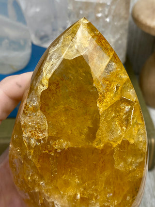 Hematite in Brazilian Quartz Flame | Stunning Inclusions from Curious Muse Crystals Tagged with carving, clear, crystal, hematite, hematite red quartz, hematoid quartz, hide-notify-btn, orange, polished, quartz, yellow