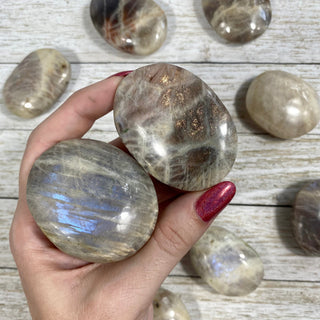 Moonstone with Sunstone Flashy Palm Stone from Curious Muse Crystals Tagged with blue, Feldspar, moonstone, orange, orthoclase, orthoclase feldspar, palm stone, palmstone, silver, sunstone