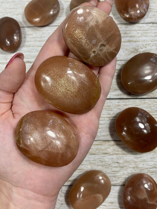 Sunstone with Moonstone Flashy Palm Stone from Curious Muse Crystals Tagged with Feldspar, moonstone, orange, orthoclase, orthoclase feldspar, palm stone, palmstone, sunstone