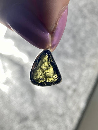 Moldavite in Sterling Silver Pendant | Genuine Tektite from Czech Republic from Curious Muse Crystals Tagged with clear, Crown crystal, crystal jewelry, genuine tektite, green, hide-notify-btn, moldavite, natural moldavite, sterling silver, tektite, Third eye stone, transformation