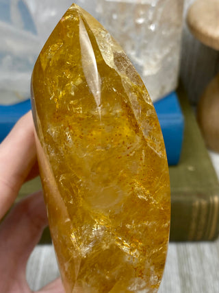 Hematite in Brazilian Quartz Flame | Stunning Inclusions from Curious Muse Crystals Tagged with carving, clear, crystal, hematite, hematite red quartz, hematoid quartz, hide-notify-btn, orange, polished, quartz, yellow
