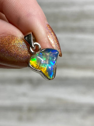Welo Opal Raw Form in Sterling Silver Pendant from Curious Muse Crystals Tagged with crystal healing, Crystal Jewelry, energy work, Ethiopian opal, flashy opal, hide-notify-btn, october crystal, opal crystal pendant, rainbow, reiki crystal, Sterling, sterling silver, Welo Opal, white opal pendant, witchy jewelry