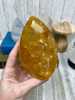 Hematite in Brazilian Quartz Flame | Stunning Inclusions from Curious Muse Crystals Tagged with carving, clear, crystal, hematite, hematite red quartz, hematoid quartz, hide-notify-btn, orange, polished, quartz, yellow