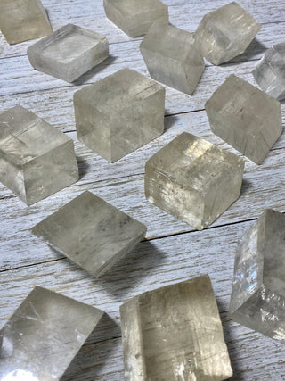 Yellow Optical Calcite Cubes from Curious Muse Crystals Tagged with calcite, clear, crystal, genuine crystal, optical calcite, raw, raw mineral, yellow
