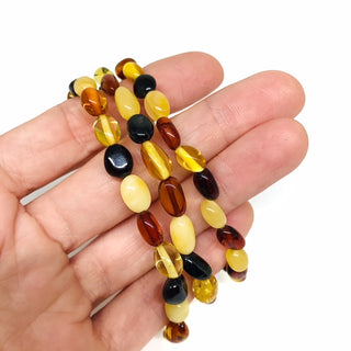 Amber Stretch Bracelet | Tricolor Coin Bead from Curious Muse Crystals Tagged with amber, bracelet, brown, crystal bracelet, Crystal healing, crystal jewelry, fine mineral, fossil, fossilized amber, gemstone bracelet, genuine crystal, mineral specimen, real amber, stretch bracelet