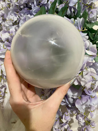Selenite Gypsum Sphere | Satin Spar Cleansing | 4" and 5" from Curious Muse Crystals Tagged with aura cleansing, beginner crystal, cleansing, cleansing crystal, clear, crown chakra, crystal healing, crystal magic, crystal sphere, energy work, genuine crystal, selenite, soothing stone, sphere, white