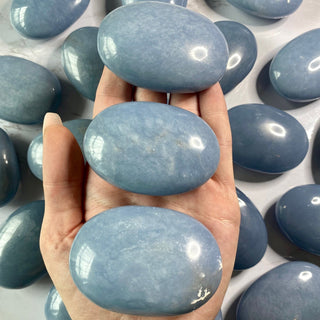 Angelite Palm Stone from Curious Muse Crystals Tagged with akashic record, angelite, anhydrite mineral, blue, blue crystal stone, calming energy, communication stone, crystal healing, palmstone, past life recall, spirit guide