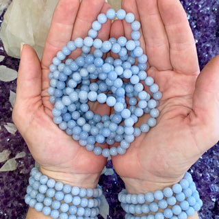 Angelite 8mm Round Bead Crystal Bracelet from Curious Muse Crystals Tagged with angel stone, angelite, angelite stone, blue, blue stone bracelet, bracelet, calming gemstone, calming jewelry, crystal jewelry, gemstone bracelet, healing stone, round gemstone