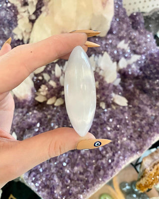Selenite Gypsum Palm Stone - Cleansing from Curious Muse Crystals Tagged with aura cleansing, beginner crystal, cleansing, cleansing crystal, clear, crown chakra, crystal healing, crystal magic, energy work, genuine crystal, hand crystal, palm stone, palmstone, selenite, soothing stone, white