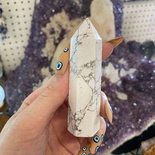 Howlite Six Sided Tower from Curious Muse Crystals Tagged with aura cleansing, black, crystal healing, crystal magic, Crystal tower, energy work, genuine crystal, howlite, Howlite tower, soothing stone, stress crystal, stress relief, tower, white, white howlite, white stone