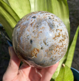 Ocean Jasper Sphere with Druzy Pockets from Curious Muse Crystals Tagged with Crystal healing, drusy pocket, hide-notify-btn, jasper, Madagascar mineral, mineral collection, natural mineral, ocean jasper, Orbicular jasper, peace and calming, purple, reiki healing, sphere, white, yellow