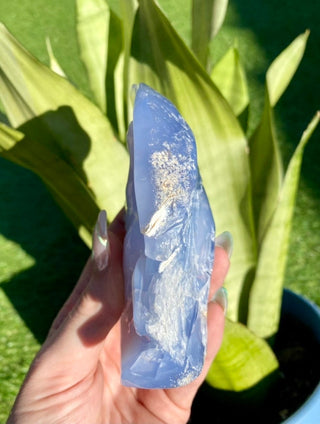 Blue Chalcedony Hand Carved Horse Geode from Curious Muse Crystals Tagged with animal carving, animal guide, blue, blue chalcedony, blue stone geode, calming crystal, chalcedony, Crystal carving, farmhouse decor, feng shui, hand carved geode, home decor stone, horse decor, horse head crystal, rearing horse statue, stone bird, western home decor