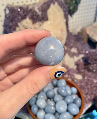 Angelite Tumbled Stone from Curious Muse Crystals Tagged with Angeline, angelite, anhydrite stone, blue, blue crystal, calming crystal, calming stone, cleansing crystal, communication stone, Crystal healing, genuine crystal, reiki work, throat chakra, tumbled stone