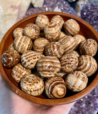 Aragonite Tumbled Stone from Curious Muse Crystals Tagged with anxiety stone, banded aragonite, brown, brown aragonite, Crystal healing, earth healing, genuine crystal, geopathic stress, gridding crystal, grounding crystal, reiki work, root chakra, stress release, tumbled stone, yellow
