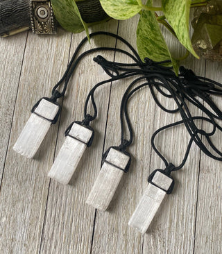 Selenite on Black Cord Necklace - Cleansing - Satin Spar from Curious Muse Crystals Tagged with cleansing stone, clear, crystal jewelry, crystal necklace, energy work, jewelry, mineral on cord, natural crystal, necklace, raw crystal, raw stone pendant, reiki healing, satin spar, selenite, white