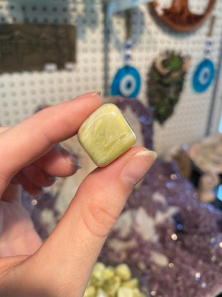 Serpentine Tumbled Stone- Infinite - Manifestation and Wealth from Curious Muse Crystals Tagged with Crystal healing, genuine crystal, green, hearth chakra, infinite, light green stone, manifestation, mineral collection, natural mineral, prosperity wealth, reiki healing, serpentine, tumbled stone