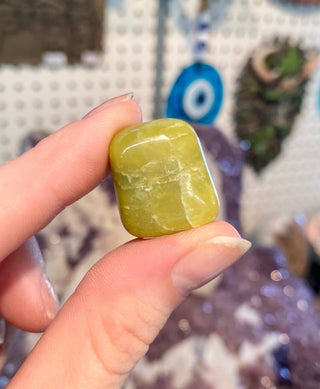 Serpentine Tumbled Stone- Infinite - Manifestation and Wealth from Curious Muse Crystals Tagged with Crystal healing, genuine crystal, green, hearth chakra, infinite, light green stone, manifestation, mineral collection, natural mineral, prosperity wealth, reiki healing, serpentine, tumbled stone