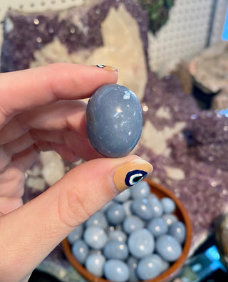 Angelite Tumbled Stone from Curious Muse Crystals Tagged with Angeline, angelite, anhydrite stone, blue, blue crystal, calming crystal, calming stone, cleansing crystal, communication stone, Crystal healing, genuine crystal, reiki work, throat chakra, tumbled stone