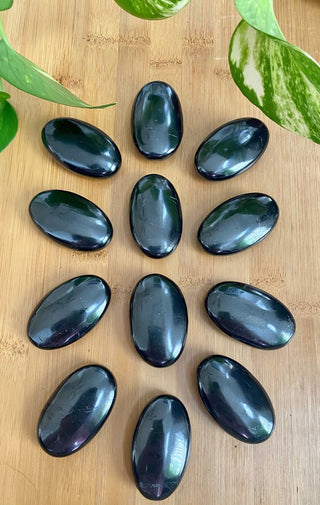 Shungite Palm Stone - Genuine Russian Shungite from Curious Muse Crystals Tagged with black, black palm stone, crystal healing, detox crystal, emf shield, genuine shungite, natural crystal palm, palm stone, palmstone, protection crystal, purification stone, reiki work, russian shungite, shungite, wifi protection