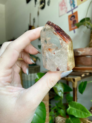 Dreamcoat Lemurian Generator - Polished Brazilian Tower Crystal from Curious Muse Crystals Tagged with clear, clear brazil quartz, dreamcoat lemurian, goethite rutile, hematite amethyst, hide-notify-btn, lemurian, lemurian generator, lemurian seed, purple, red, secondary growth, super seven, synergy seven, yellow