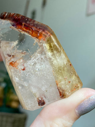 Dreamcoat Lemurian Generator - Polished Brazilian Tower Crystal from Curious Muse Crystals Tagged with clear, clear brazil quartz, dreamcoat lemurian, goethite rutile, hematite amethyst, hide-notify-btn, lemurian, lemurian generator, lemurian seed, purple, red, secondary growth, super seven, synergy seven, yellow
