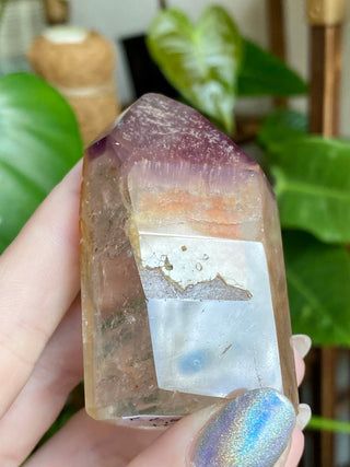 Dreamcoat Lemurian Generator - Polished Brazilian Tower Crystal from Curious Muse Crystals Tagged with clear, clear brazil quartz, dreamcoat lemurian, goethite rutile, hematite amethyst, hide-notify-btn, lemurian, lemurian generator, lemurian seed, purple, red, secondary growth, super seven, synergy seven, yellow