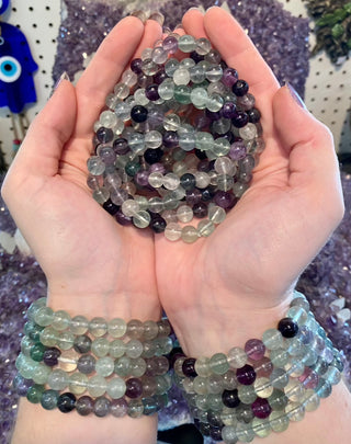 Fluorite 8mm Round Bead Crystal Bracelet from Curious Muse Crystals Tagged with 8mm beads, blue, bracelet, clear, crystal jewelry, fluorite, gemstone bead, gemstone jewelry, green, healing jewelry, heart healing, magician stone, memory stone, natural crystal, purple, rainbow fluorite, student stone