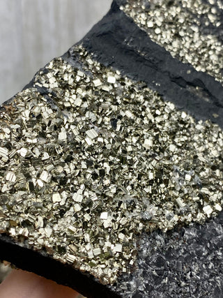 Pyrite on Shungite Raw Layered Plate | Brazil from Curious Muse Crystals Tagged with abundance, black, brazil, cleansing, gold, manifestation, purification, pyrite, shungite