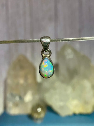 Welo Opal in Sterling Silver Pendant from Curious Muse Crystals Tagged with crystal healing, Crystal Jewelry, energy work, Ethiopian opal, flashy opal, hide-notify-btn, october crystal, opal crystal pendant, rainbow, reiki crystal, Sterling, sterling silver, Welo Opal, white opal pendant, witchy jewelry