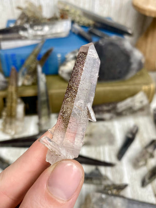 Quartz with Hematite and Lithium inclusions | Afghanistan from Curious Muse Crystals Tagged with Afghanistan, hematite, hematite red quartz, Laser quartz, lithium, Lithium quartz, Specular hematite