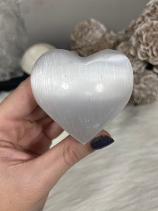 Selenite 2” Heart Stone from Curious Muse Crystals for 10. Tagged with aura cleansing, beginner crystal, cleansing crystal, clear, crown chakra, crystal healing, crystal heart, crystal magic, energy work, genuine crystal, heart, selenite, soothing stone, white