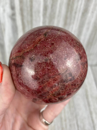 Rhodonite Sphere from Madagascar from Curious Muse Crystals Tagged with crystal, crystal energy, crystal sphere, hide-notify-btn, madagascar, palm stone, palmstone, pink, polished, red, reiki healing, Rhodonite, sphere