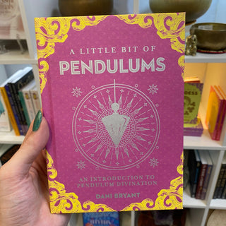 Little Bit of Pendulums: An Introduction to Pendulum Divination from Curious Muse Crystals Tagged with little bit, lucid dreaming, modern witch, pendulum, self care, third eye, witch book
