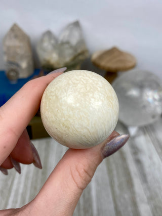 Scolecite Sphere from Curious Muse Crystals Tagged with crystal sphere, fine mineral, india, quartz, scolecite, sphere, zeolite